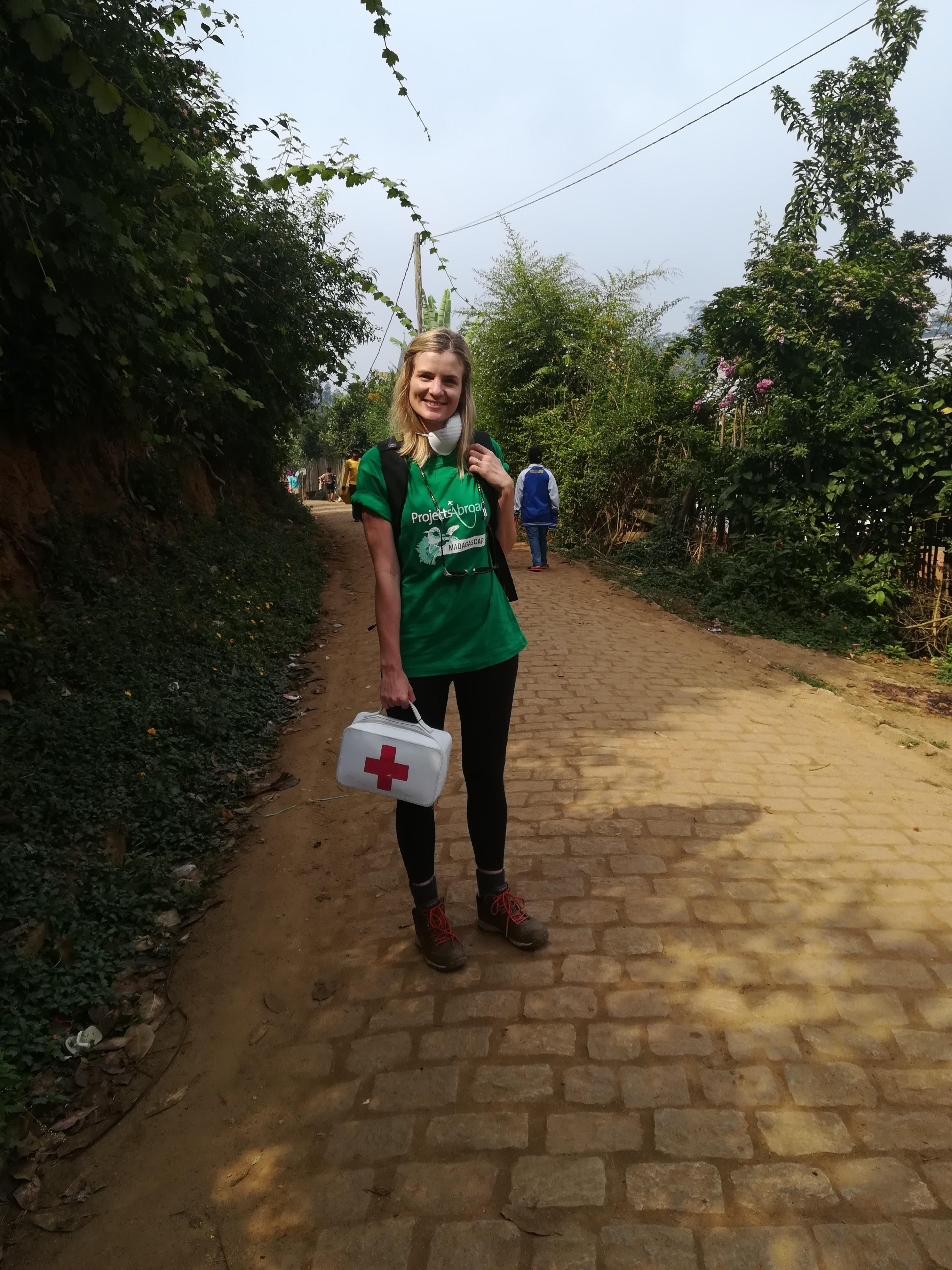 Interns distributing first aid kits to local schools during their public health internship in Madagascar with Projects Abroad. A female intern is pictured whilst distributing first aid kits to local schools during her public health internship in Madagascar.